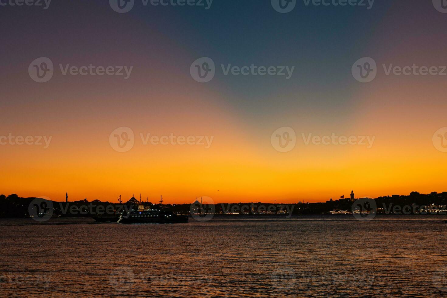 Istanbul skyline with crepuscular rays at sunset. photo