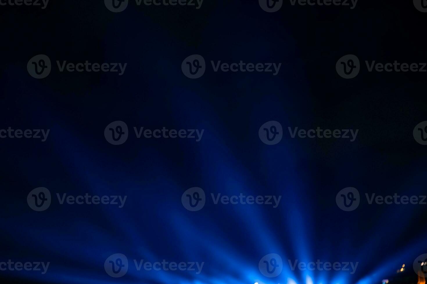 Blue spotlight rays. Projector light rays background photo