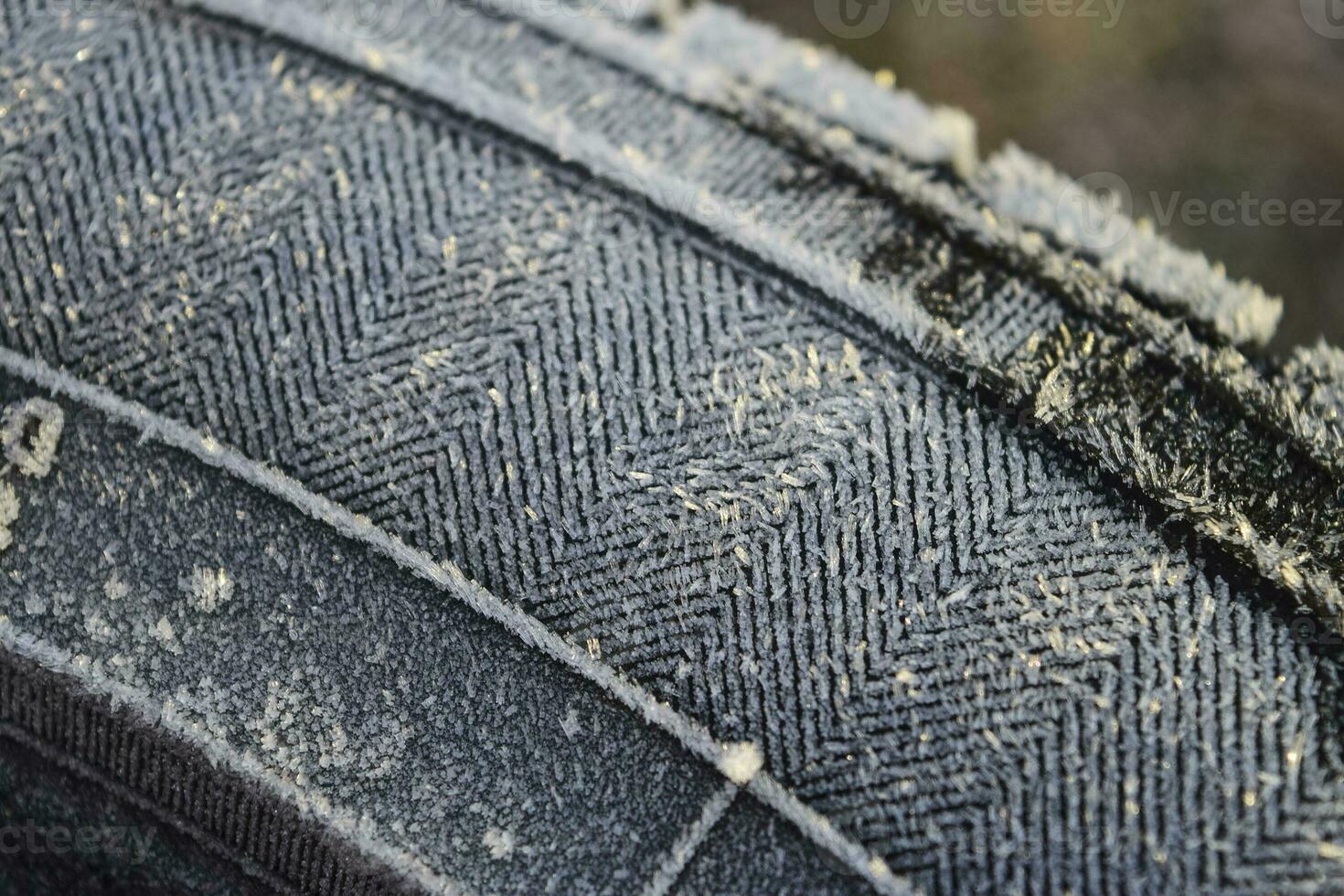 Hoarfrost on a rubber tire wheel photo