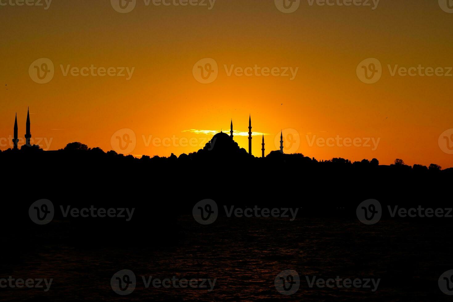 Istanbul at sunset. Suleymaniye Mosque silhouette. photo