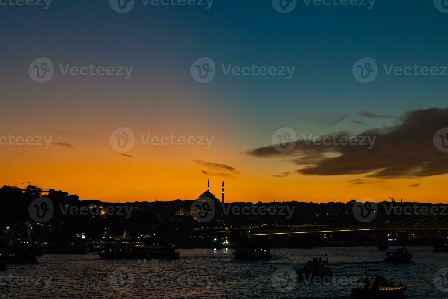 Istanbul view at sunset. Fatih Mosque and Golden Horn photo