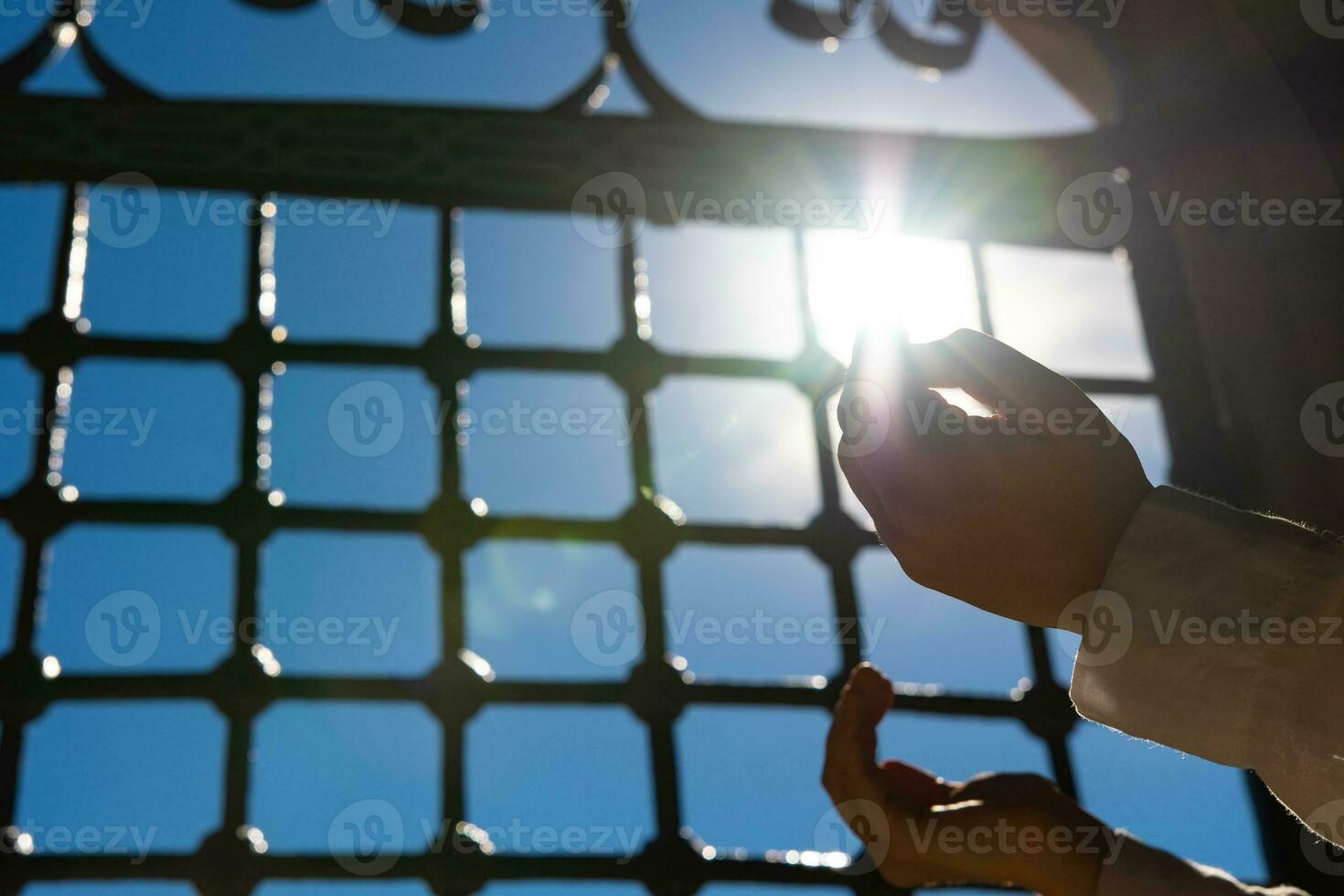 Islamic background photo. Muslim woman praying with raising hands. photo