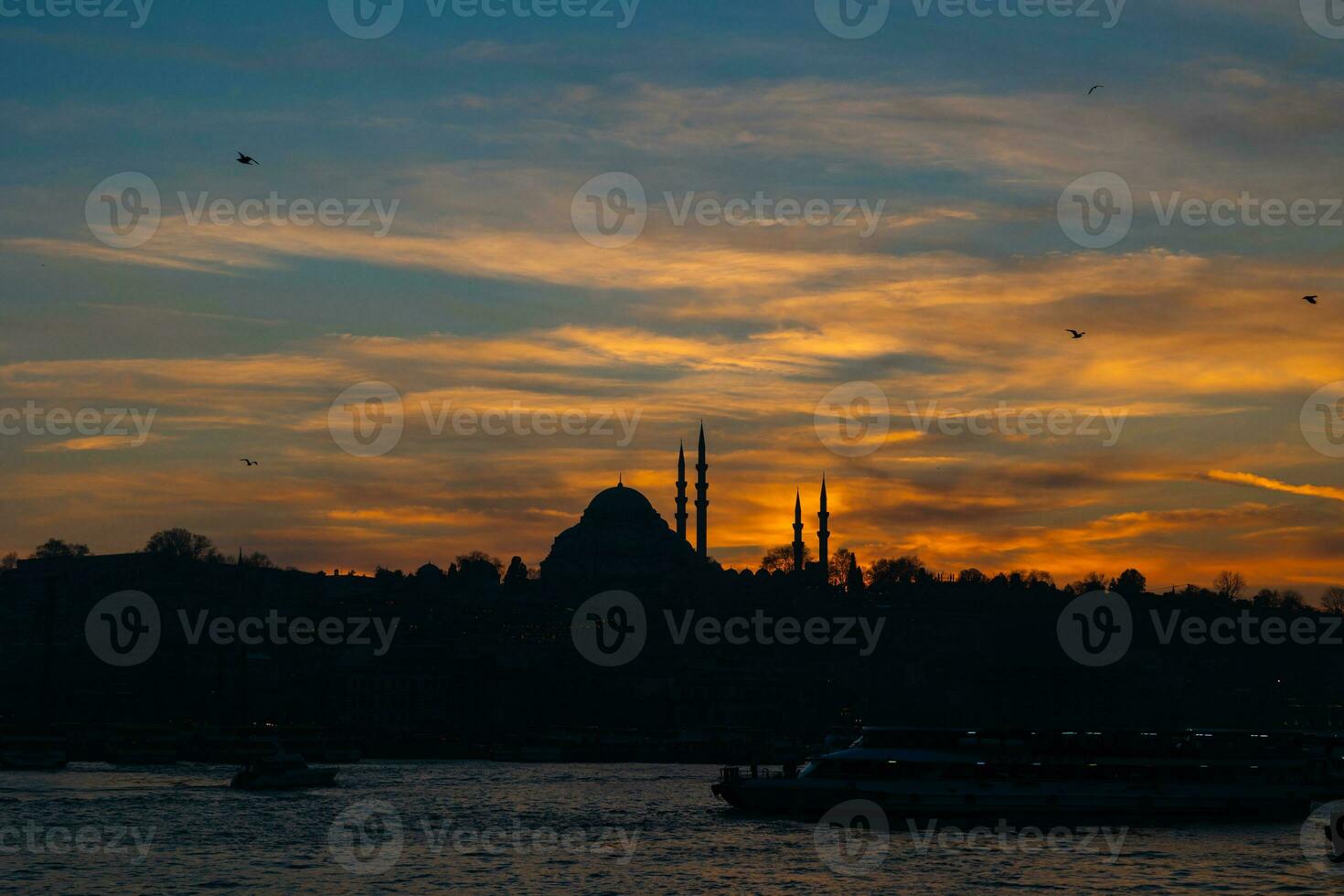 Istanbul silhouette background. Silhouette of Suleymaniye Mosque at sunset. photo