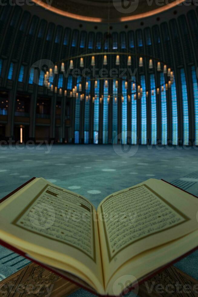 Islamic vertical photo. The Holy Quran in focus in a mosque photo