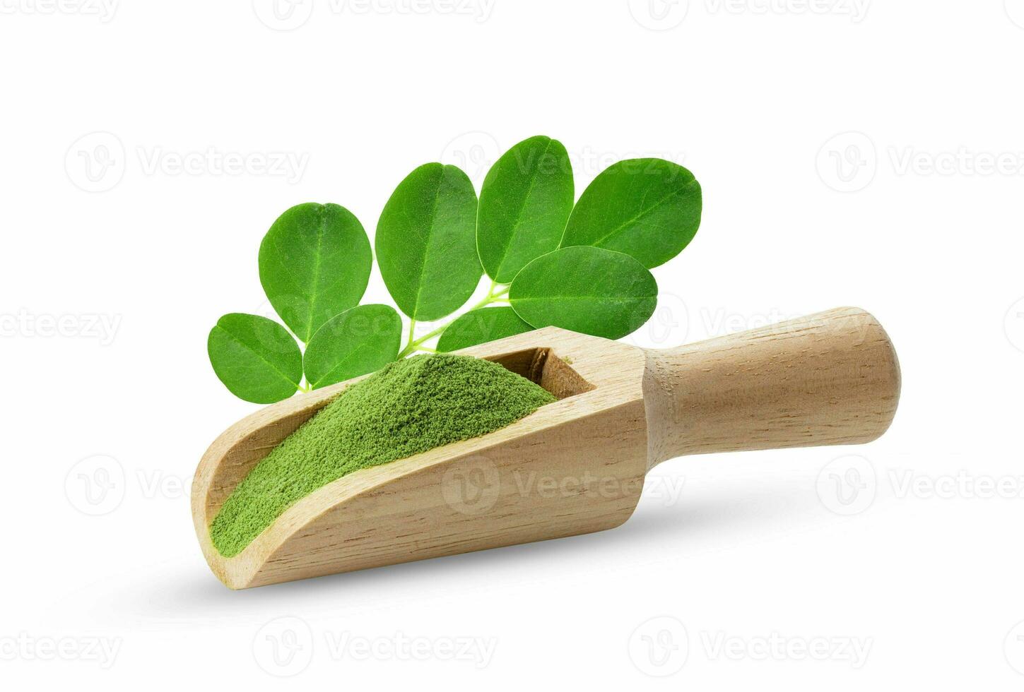 Moringa leaf with powder in scoop isolated on white background photo