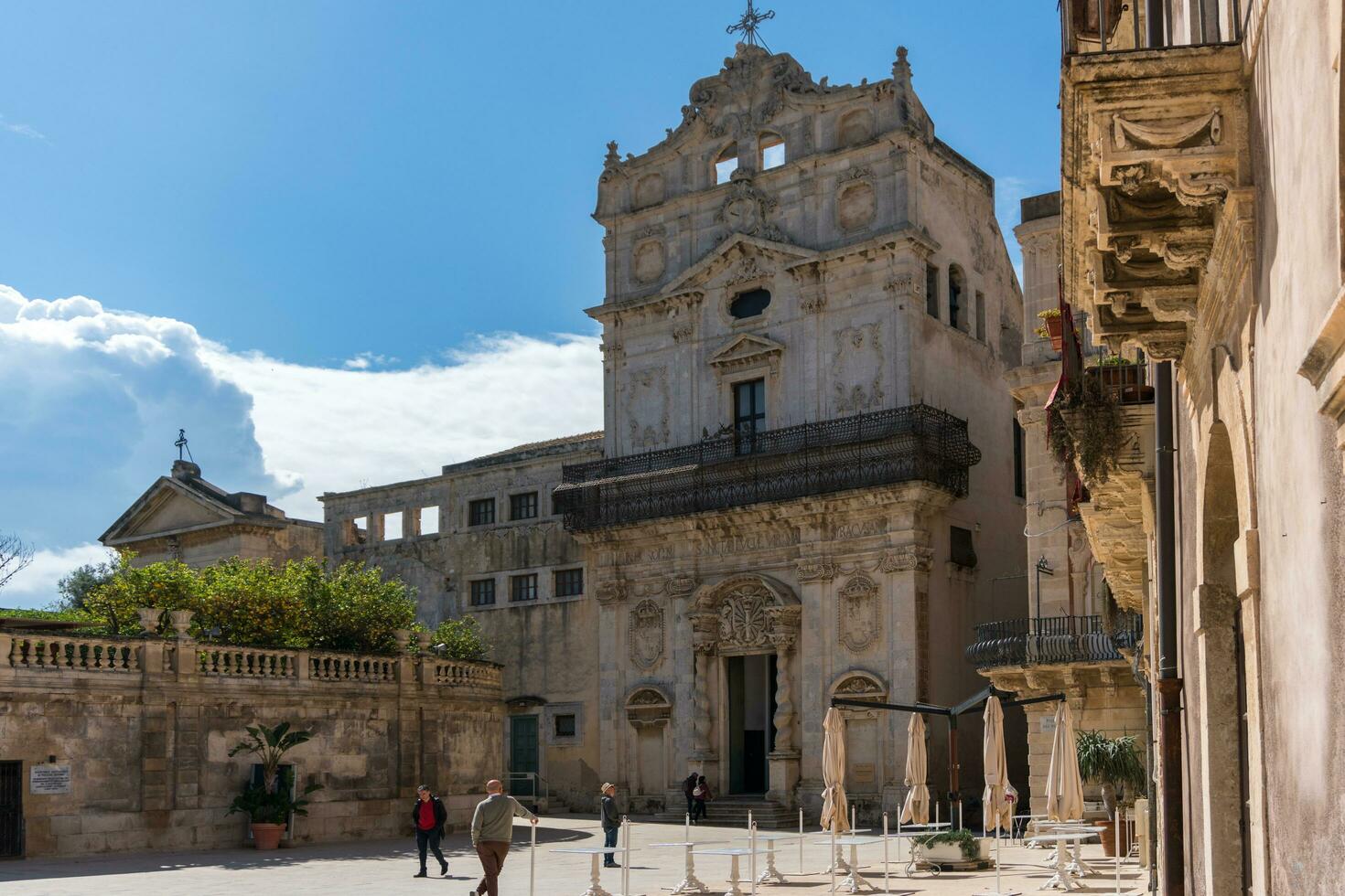 Syracuse, Italy-May 9, 2022-View of the Church of Santa Lucia alla Badia in the cathedral square during a sunny day photo