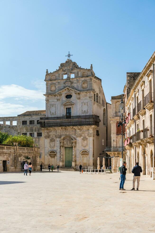 Syracuse, Italy-May 9, 2022-View of the Church of Santa Lucia alla Badia in the cathedral square during a sunny day photo