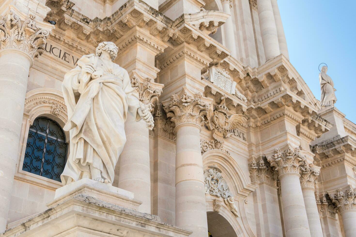 Syracuse, Italy-May 9, 2022-Metropolitan Cathedral of the Nativity of the Holy Mary in Piazza del Duomo during a sunny day photo