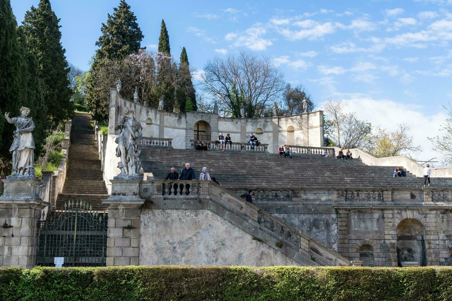 Monselice, Italy-April 16, 2023-people on the Exedra of Saint Francis Xavier in Monselice during a sunny day photo