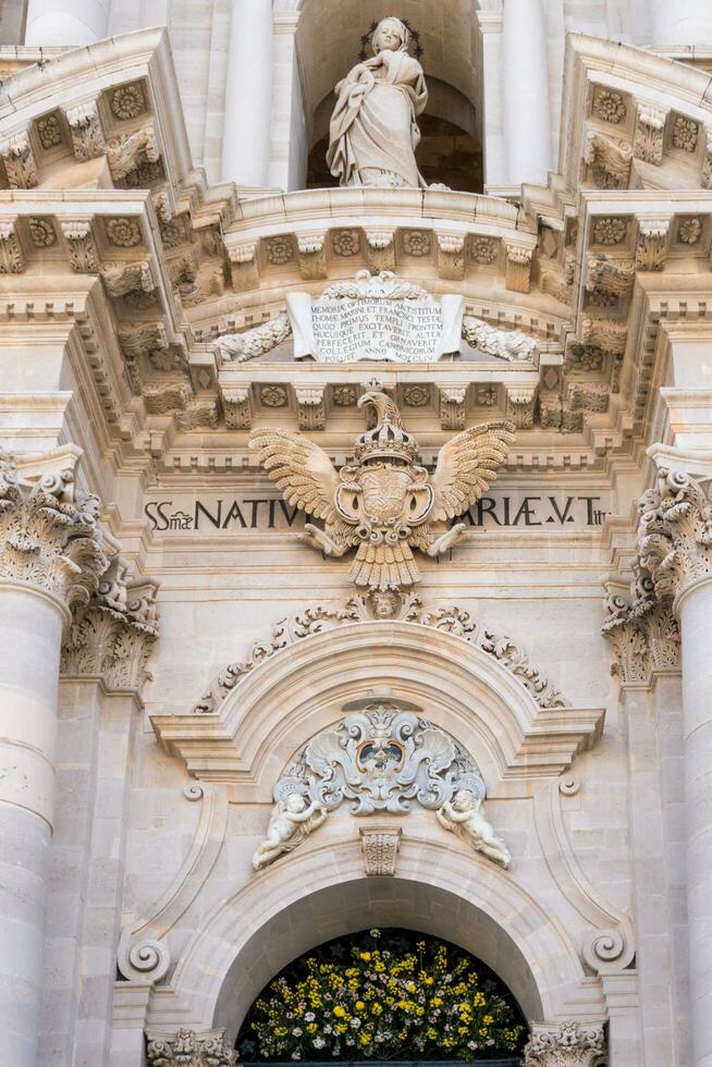 Syracuse, Italy-May 9, 2022-Metropolitan Cathedral of the Nativity of the Holy Mary in Piazza del Duomo during a sunny day photo
