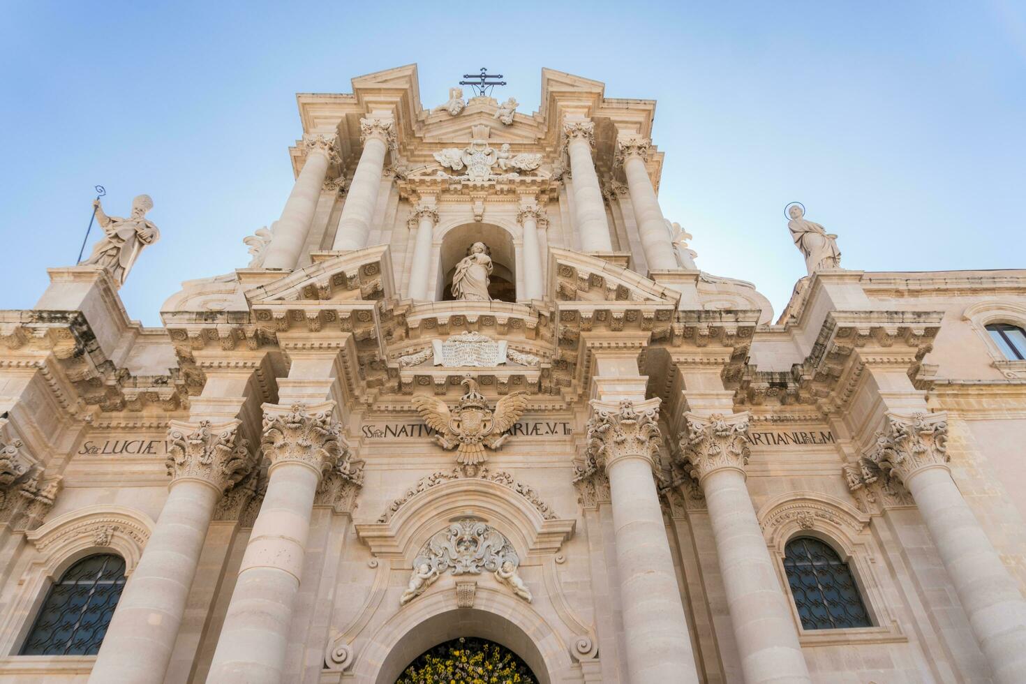 Syracuse, Italy-May 9, 2022-Metropolitan Cathedral of the Nativity of the Holy Mary in Piazza del Duomo during a sunny day photo