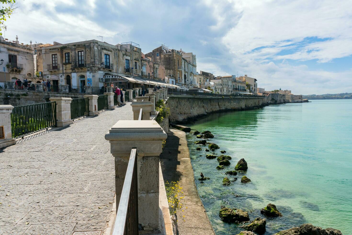 Syracuse, Italy-May 9, 2022-View of the famous pedestrian route located on the Alfeo seafront in Syracuse during a sunny day photo
