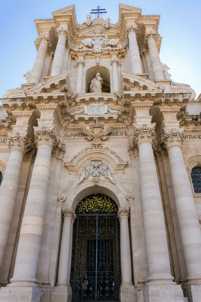 Syracuse, Italy-May 9, 2022-Metropolitan Cathedral of the Nativity of the Holy Mary in Piazza del Duomo during a sunny day photo