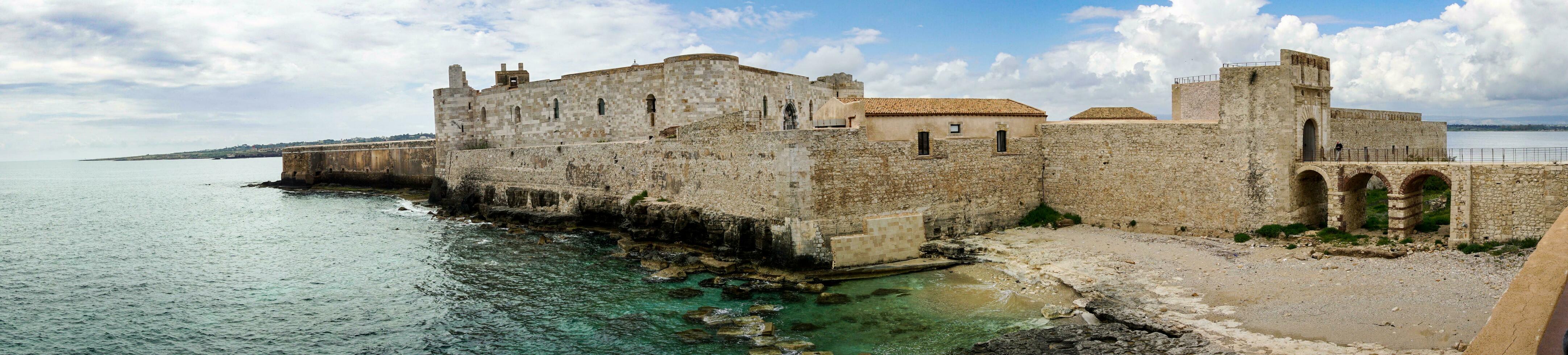Syracuse, Italy-May 9, 2022-view of the famous Maniace Castle on the island of Ortigia in Syracuse during a sunny day photo