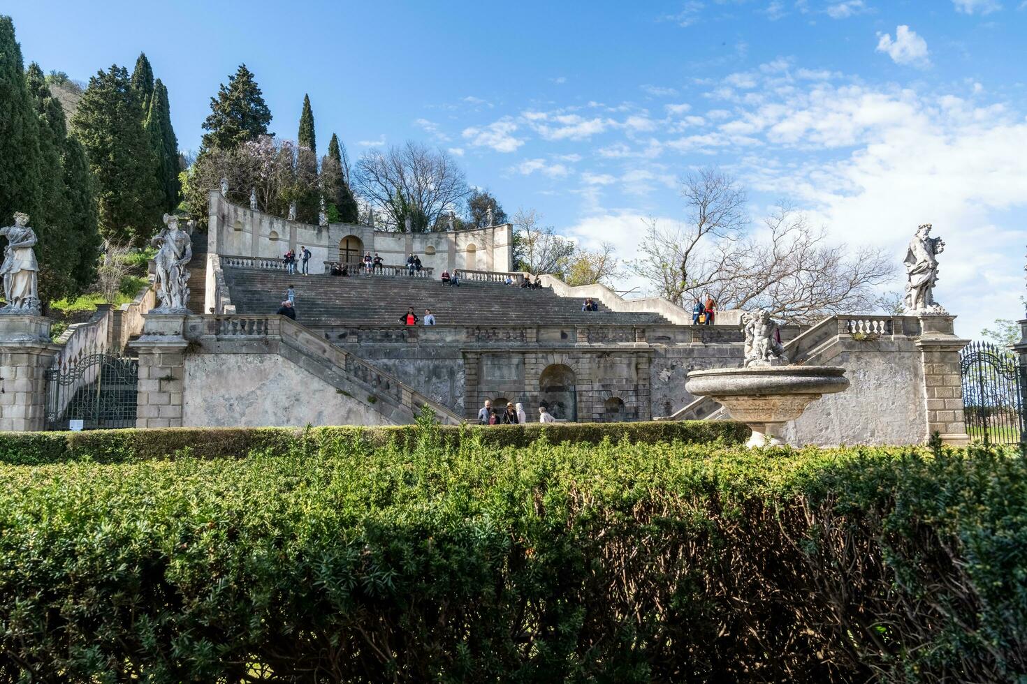 Monselice, Italy-April 16, 2023-people on the Exedra of Saint Francis Xavier in Monselice during a sunny day photo
