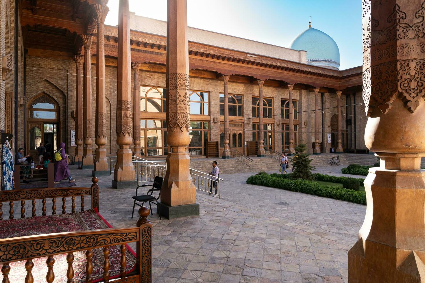 Tashkent, Uzbekistan-august 11, 2023-people in the courtyard of the Khazrati Imam Mosque in the Hazrati Imam complex during a sunny day. photo