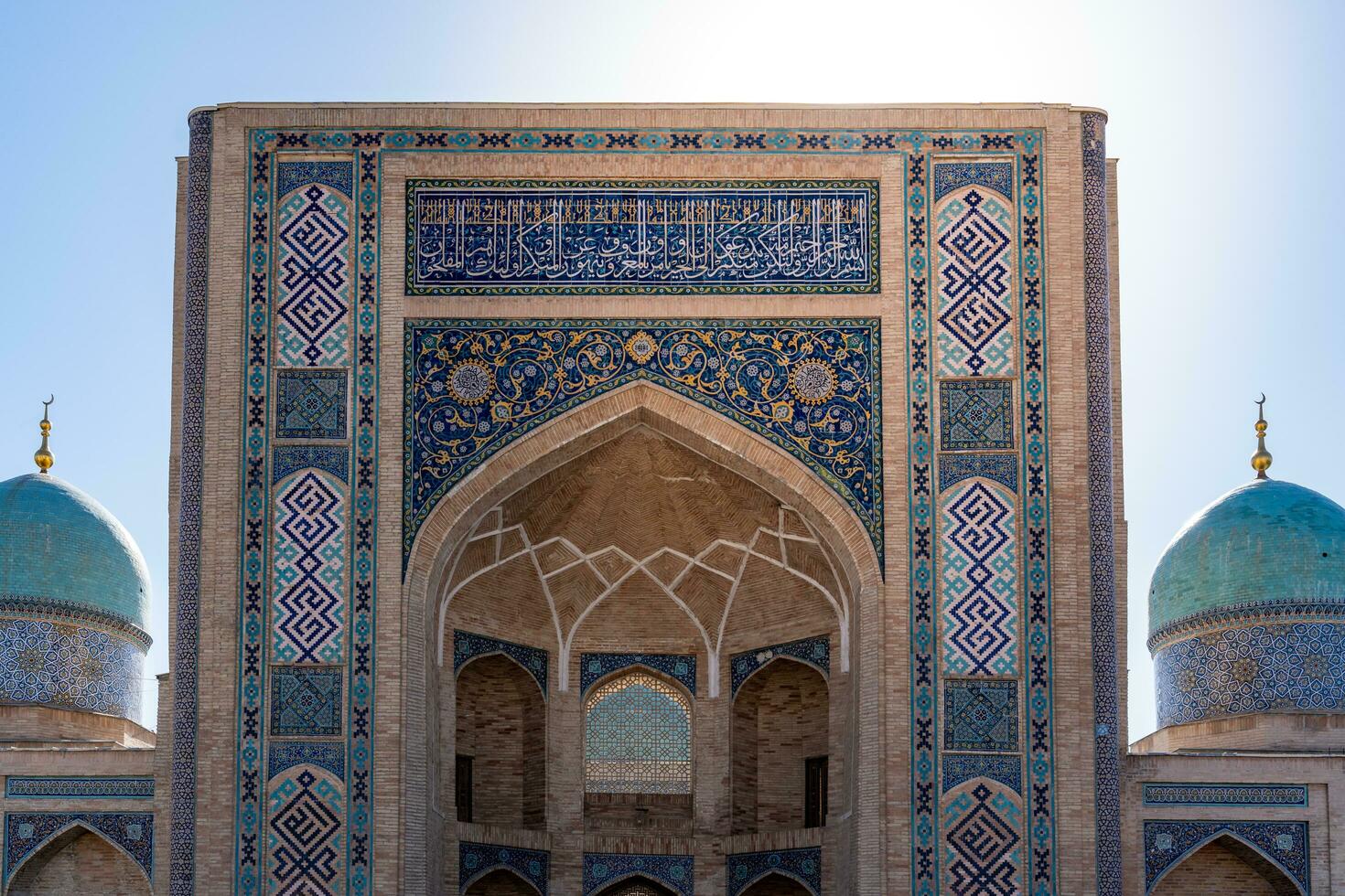 Tashkent, Uzbekistan-august 11, 2023-view of the entrance of the Tillya Sheikh Mosque  during a sunny day.The complex is a square that includes a set of religious buildings in Tashkent photo