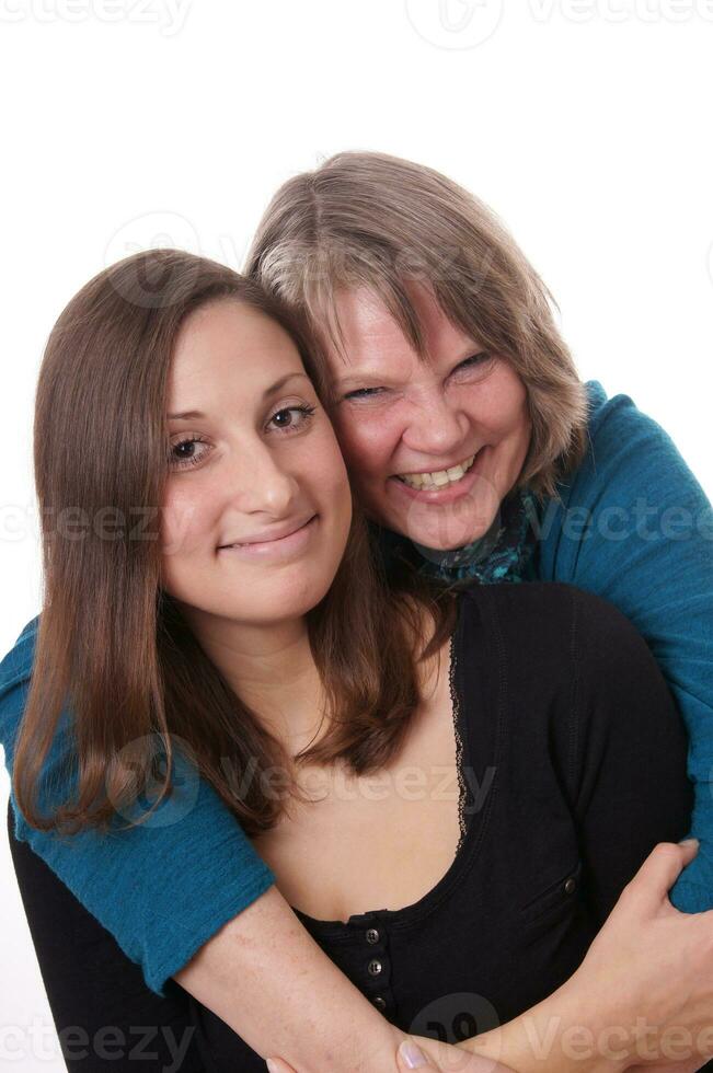 mother hugging daughter photo
