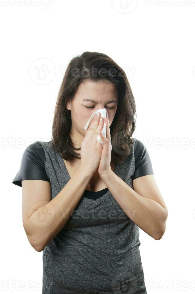 young woman blowing nose photo