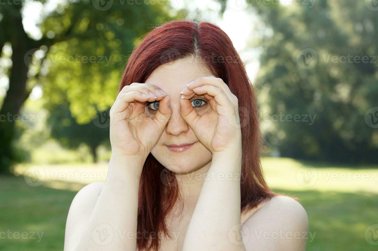 hands imitating binoculars photo