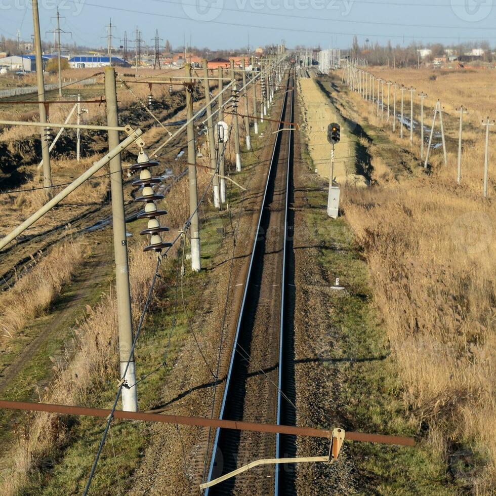 Plot railway. Top view on the rails. High-voltage power lines for electric trains photo