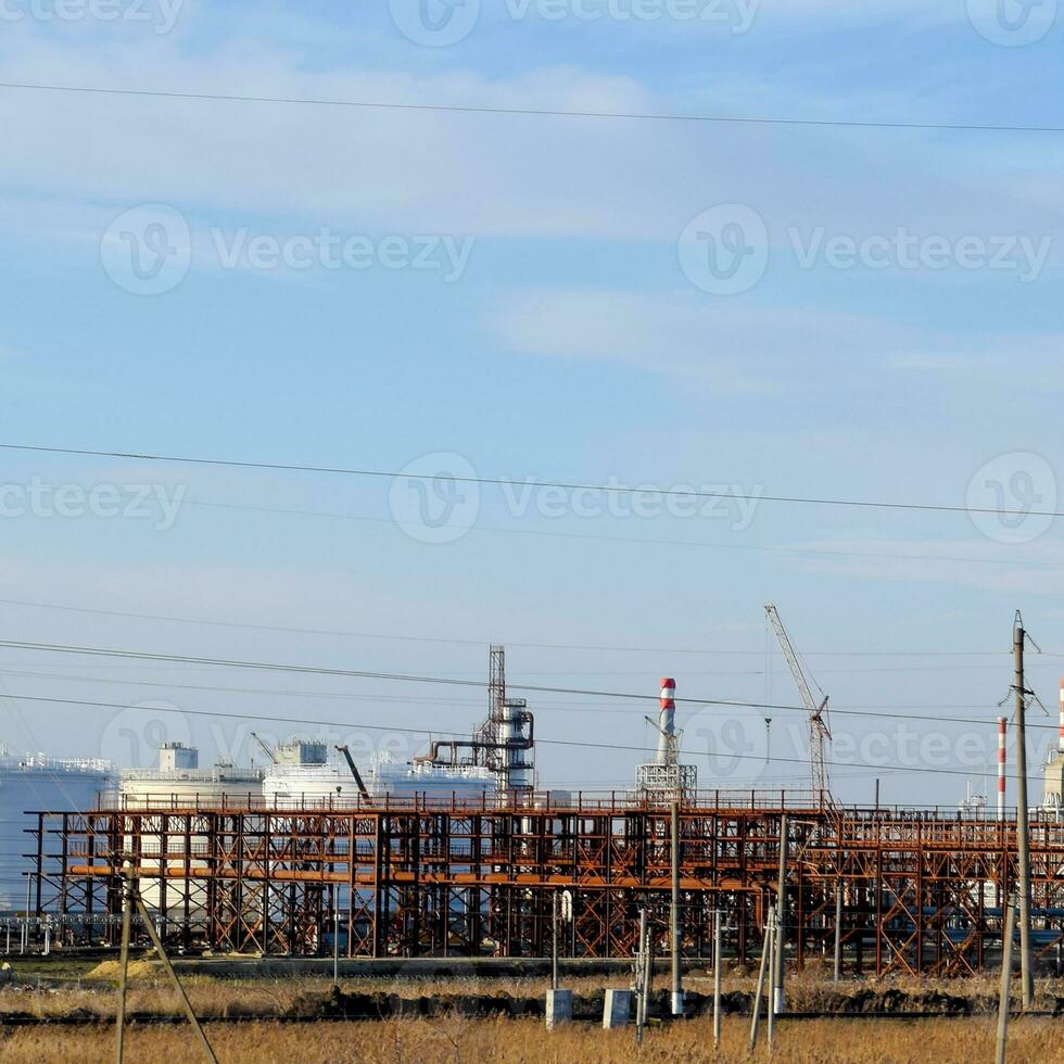 Distillation columns, pipes and other equipment furnaces refinery. photo