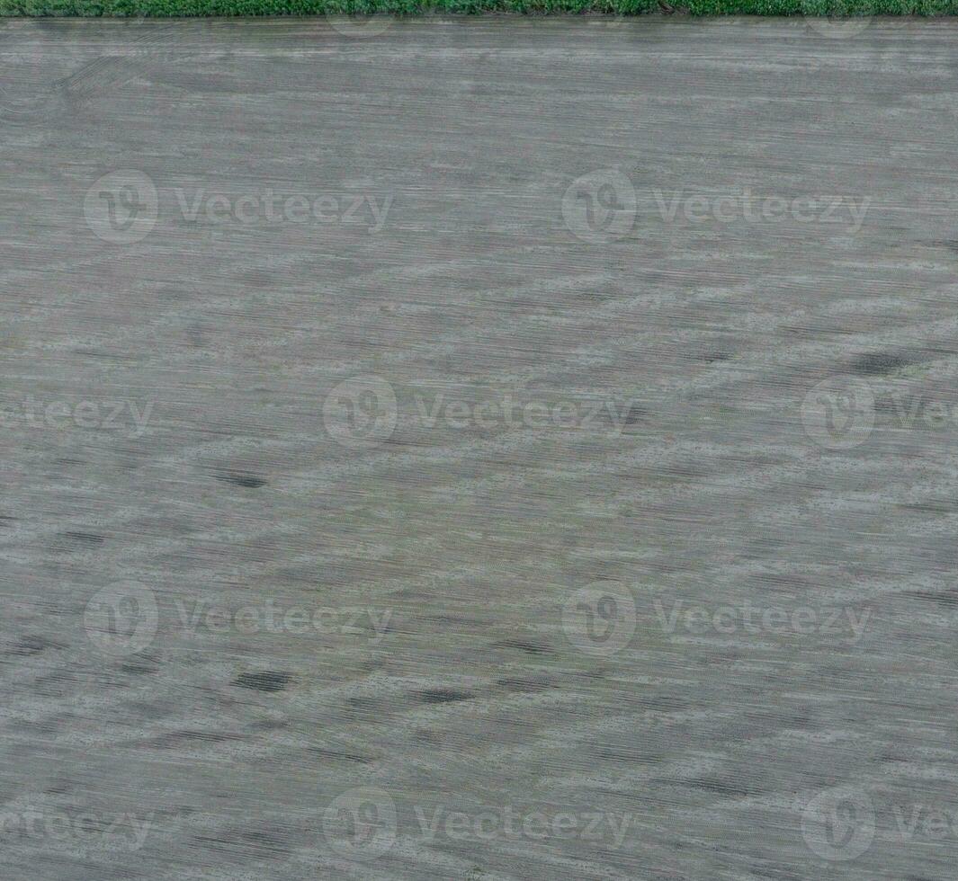 Top view of a plowed field. Background texture of the surface of the plowed field. Shooting with quadrocopters photo