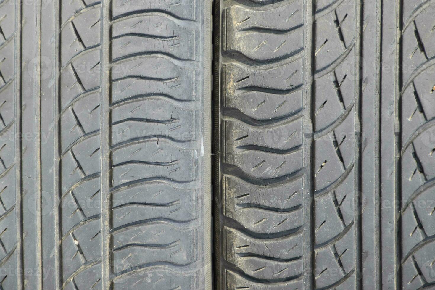 The background of the tread pattern of the car wheel. Rubber tir photo