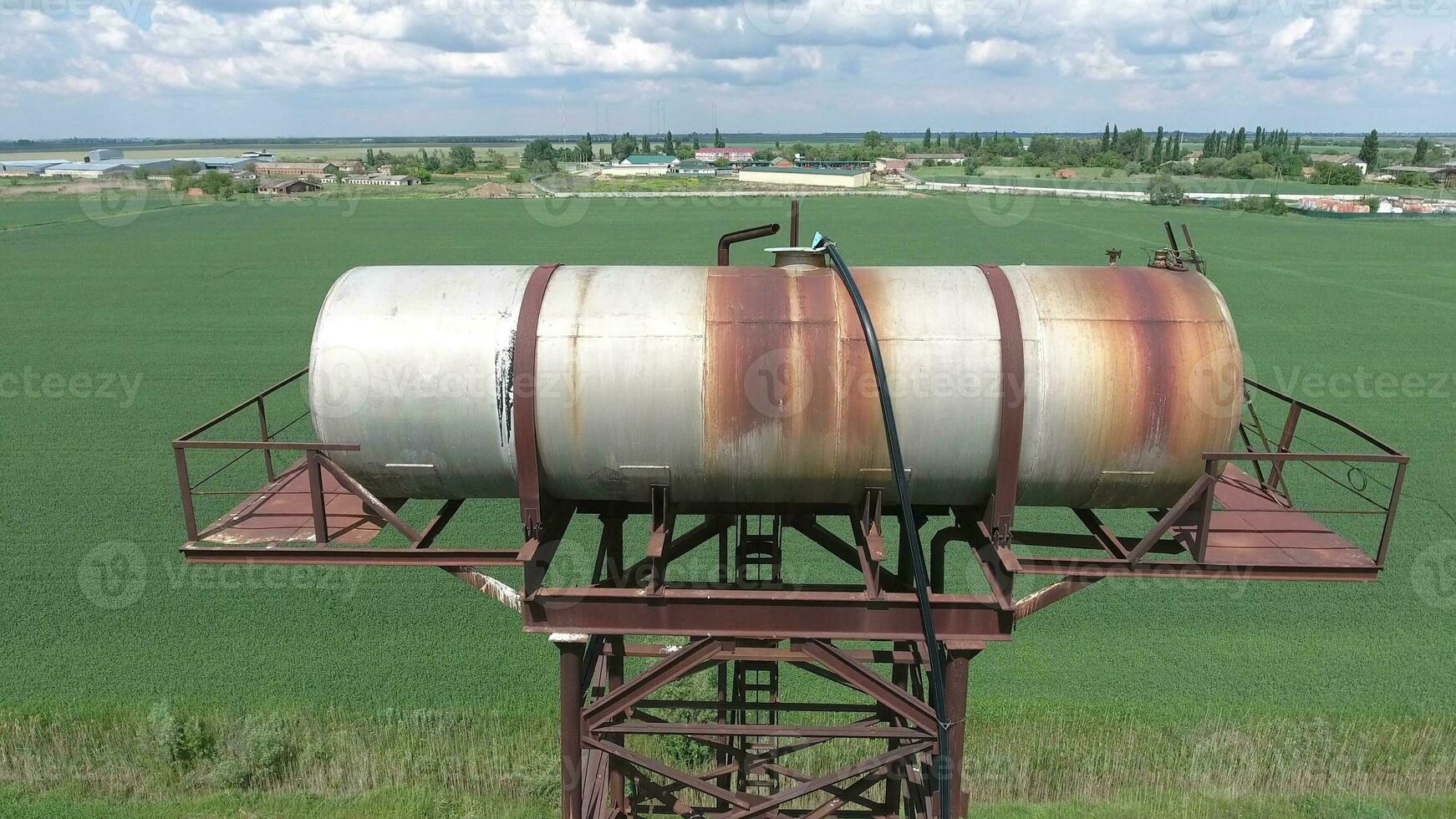 The water tower. An old rustic communal communication. The water tower photo