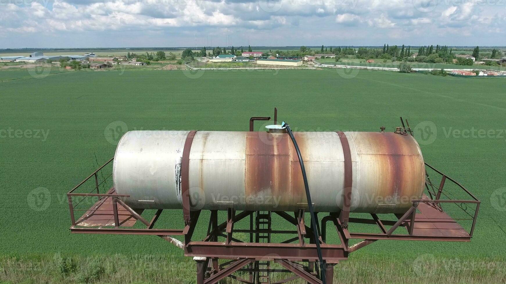 The water tower. An old rustic communal communication. The water tower photo