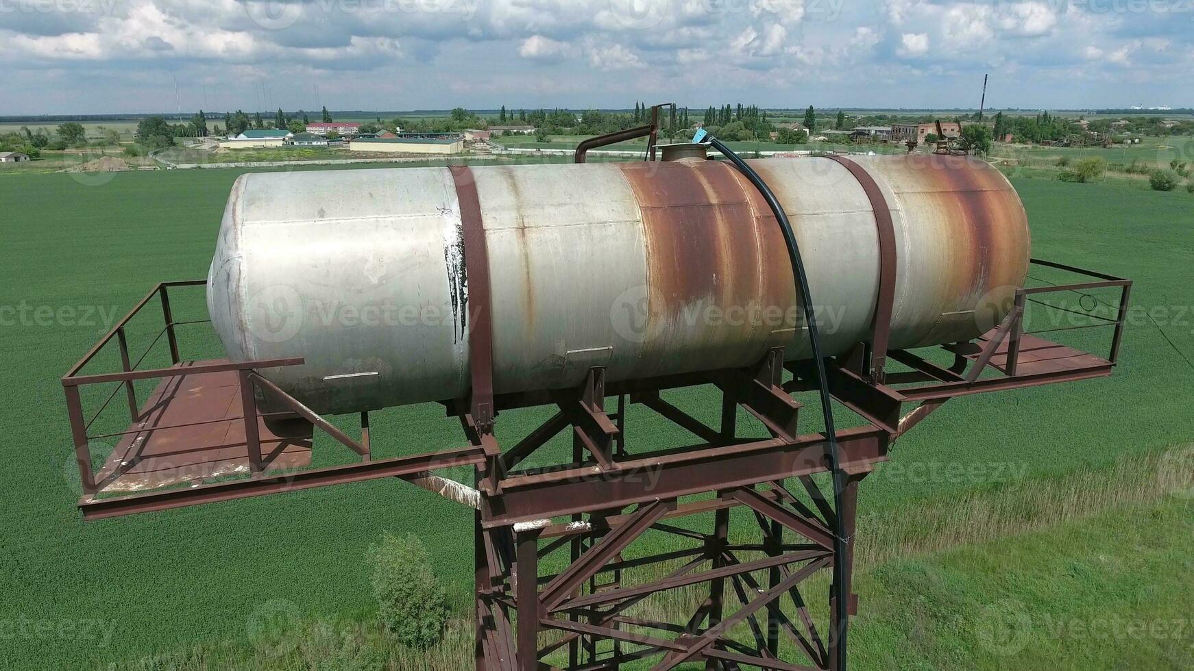 The water tower. An old rustic communal communication. The water tower photo