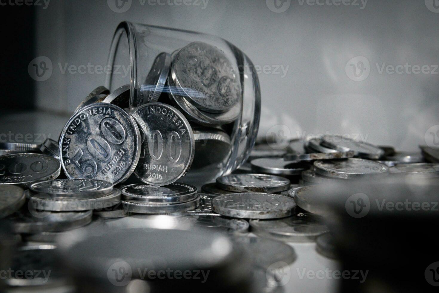 Coin Indonesian rupiah and laptop photo