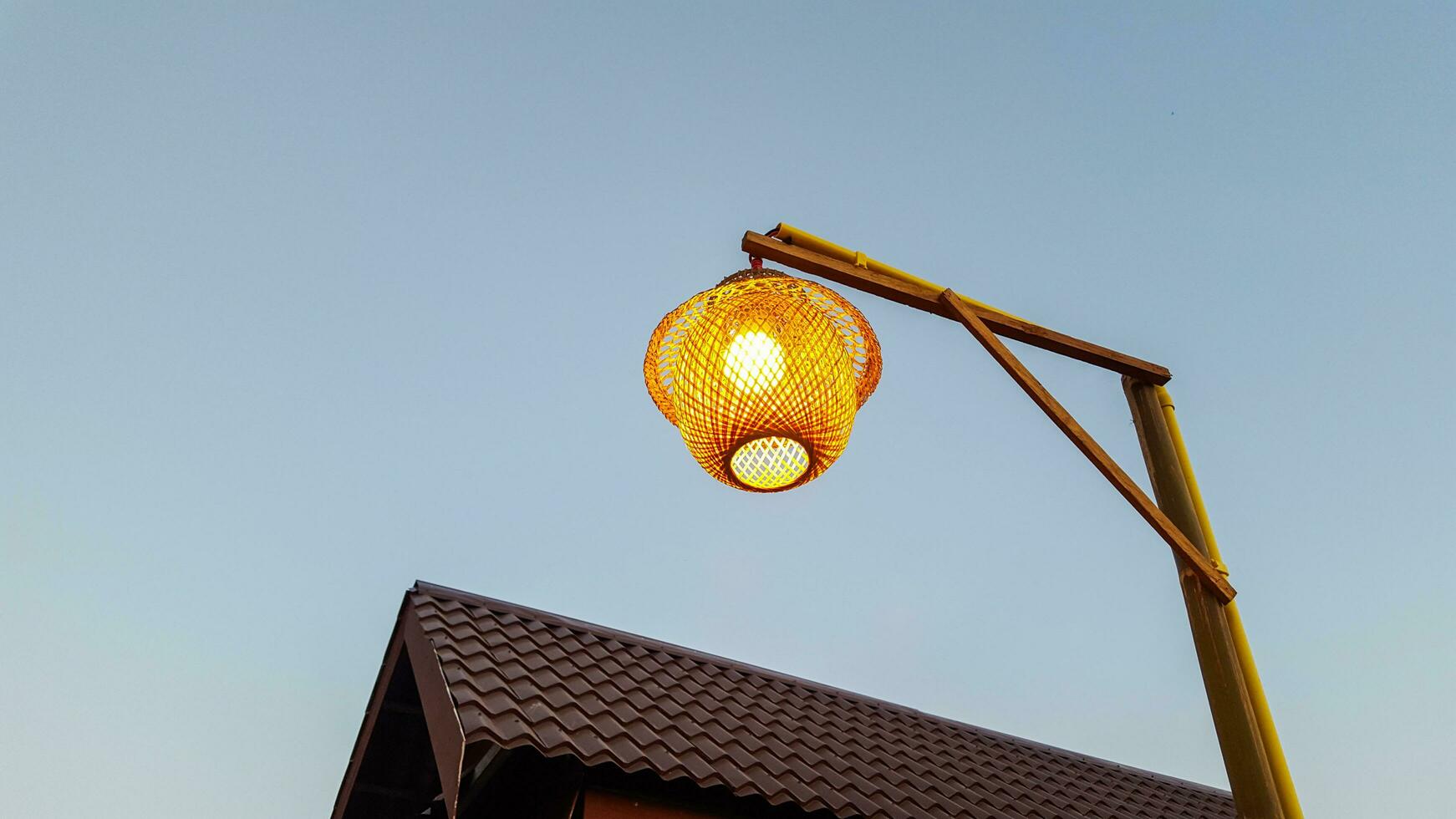 Traditional weaved bamboo lamp photo