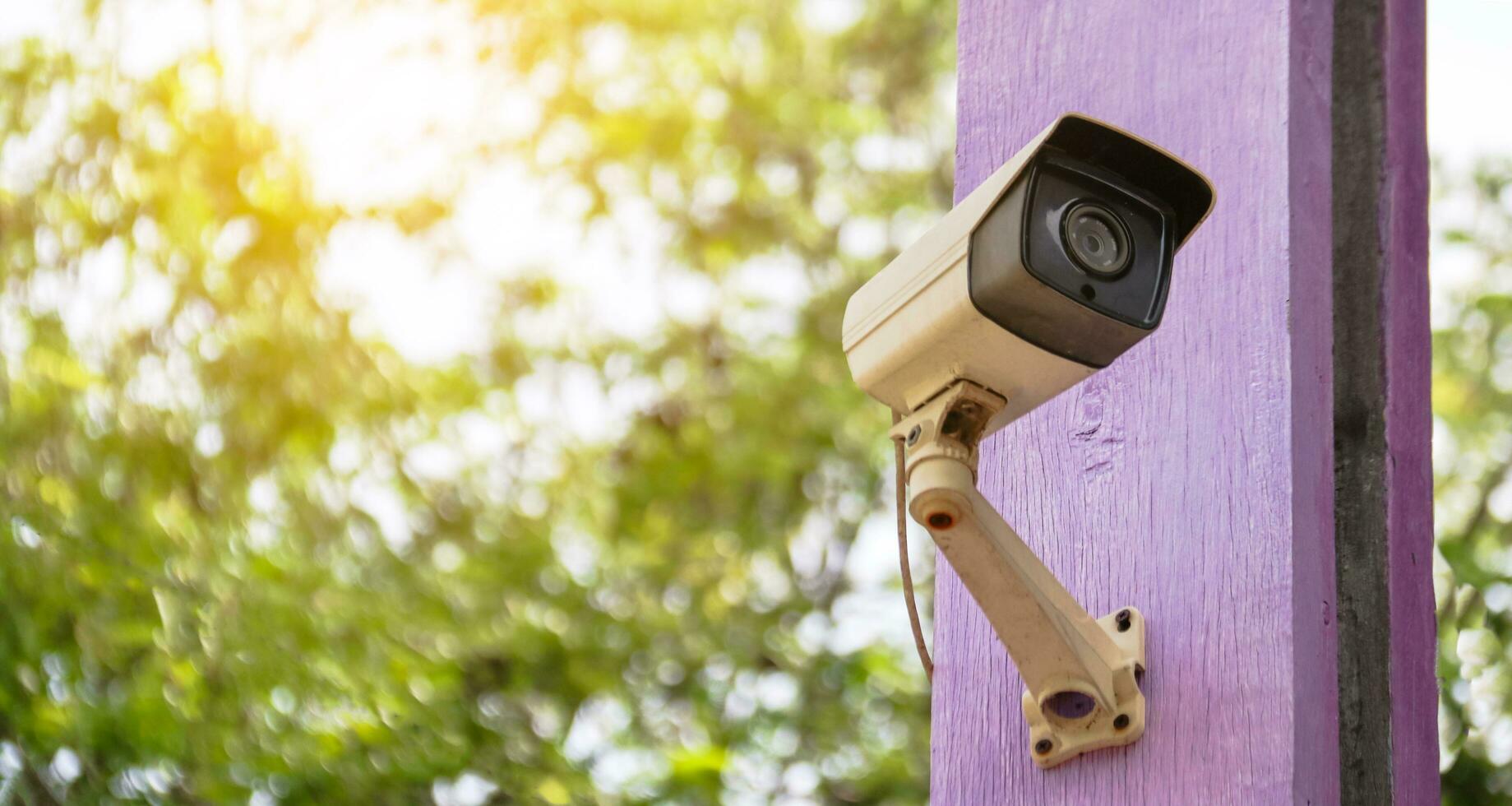 Traditional surveillance camera installed at the house photo