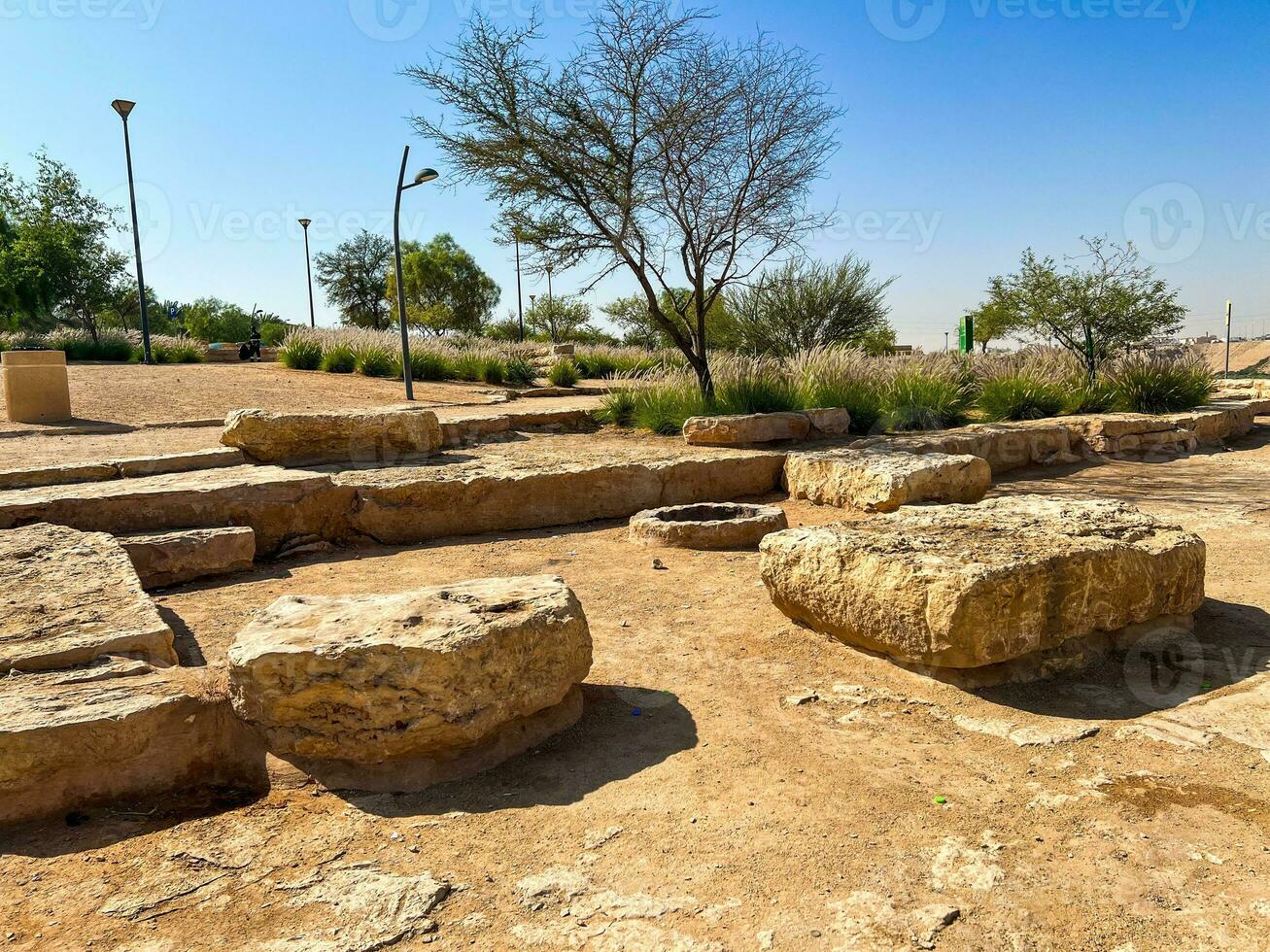 Public barbecue place  in a Wadi namar park riyadh . The stone block allows people to grill food outdoors. Fire place for a BBQ party. photo