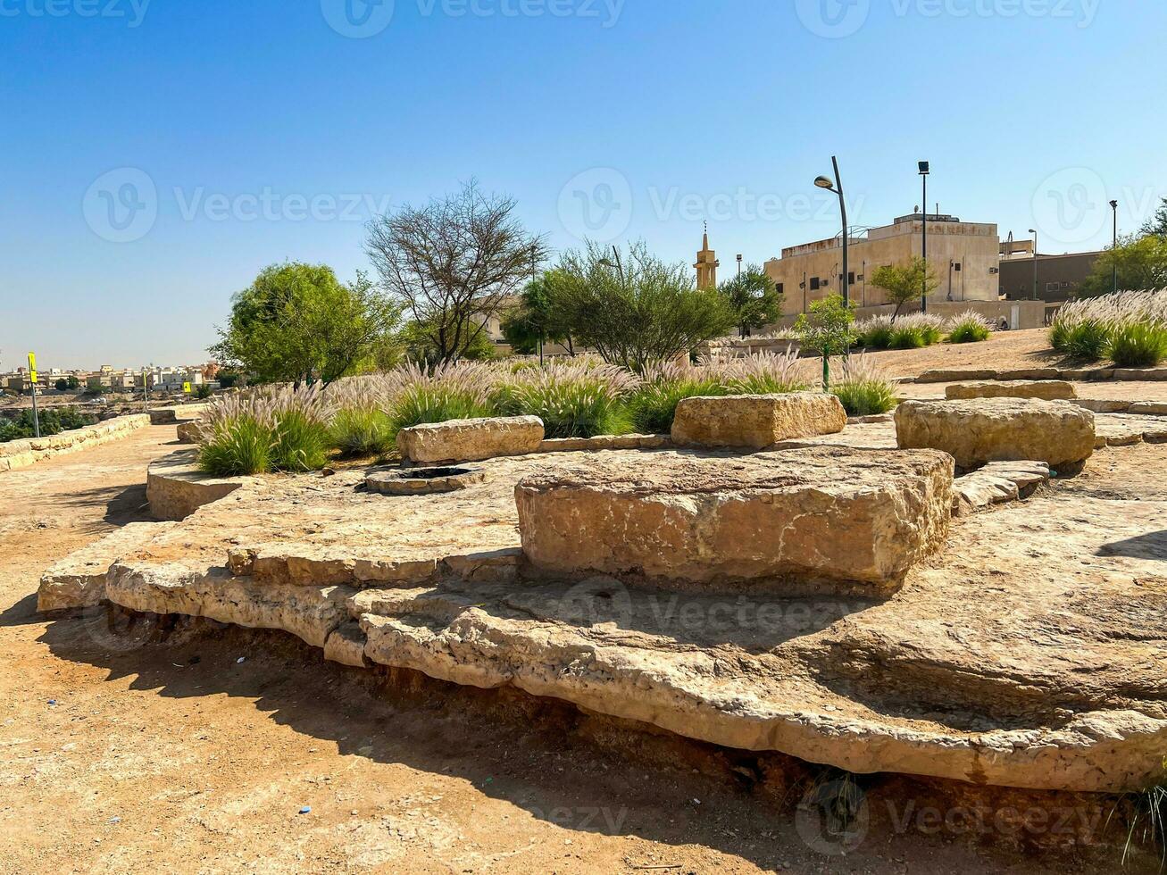 Public barbecue place  in a Wadi namar park riyadh . The stone block allows people to grill food outdoors. Fire place for a BBQ party. photo