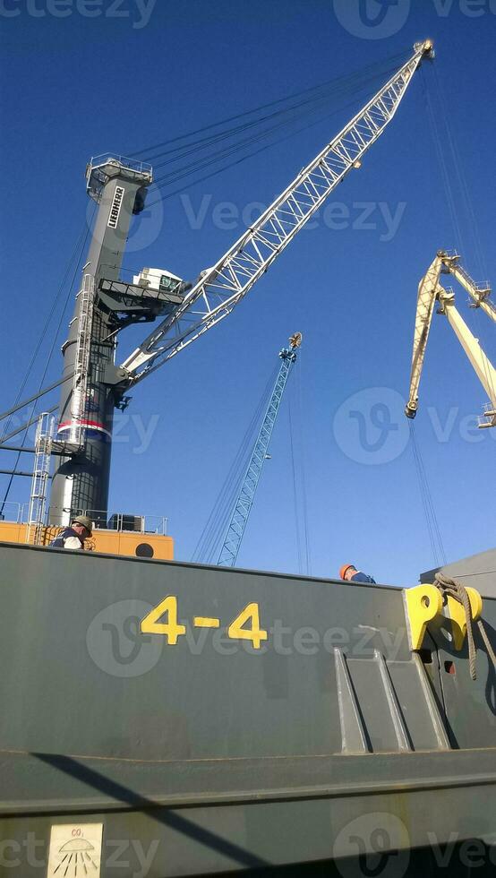 View of the tower crane. Industrial port. Lifting mechanisms photo