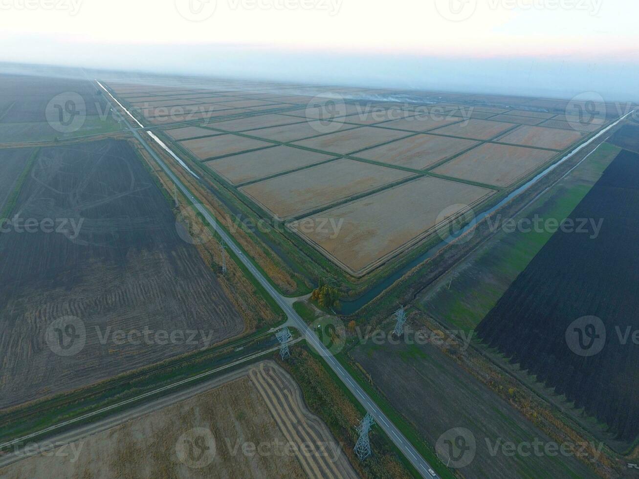 Crossroads paved roads through the fields. View from above photo