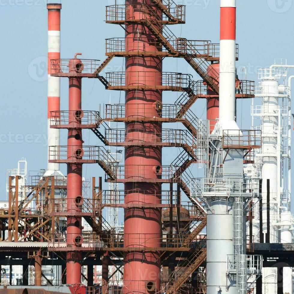 Distillation columns, pipes and other equipment furnaces refinery. photo