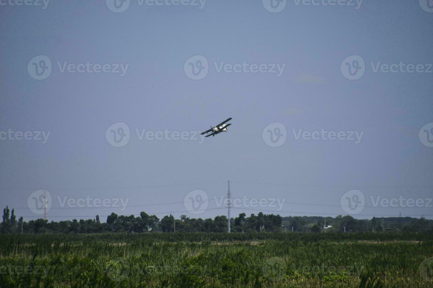 The spraying of fertilizers and pesticides on the field with the photo