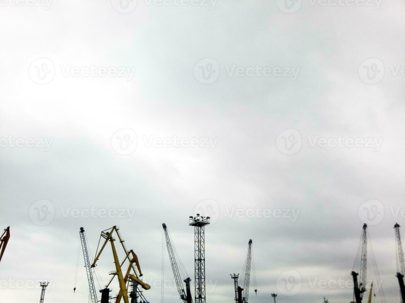 port cranes in the port against the sky. photo