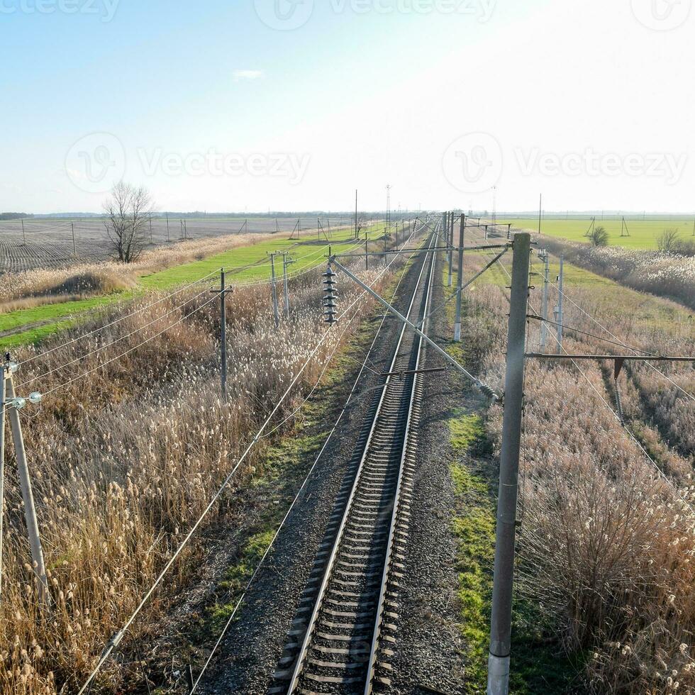 Plot railway. Top view on the rails. High-voltage power lines for electric trains photo