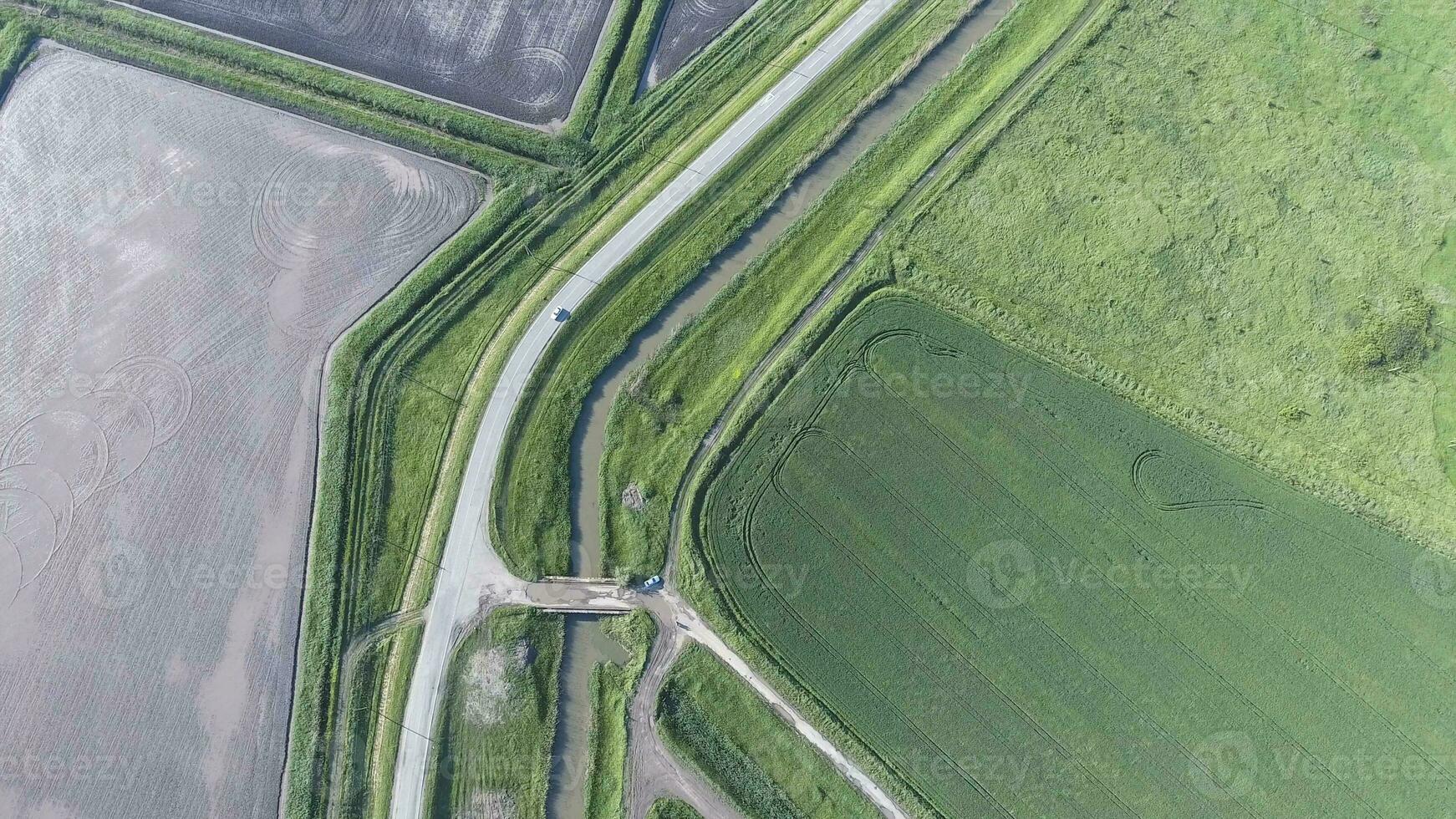 The top view of the wheat field and the plowed field under Fig. Shooting from a drone. photo