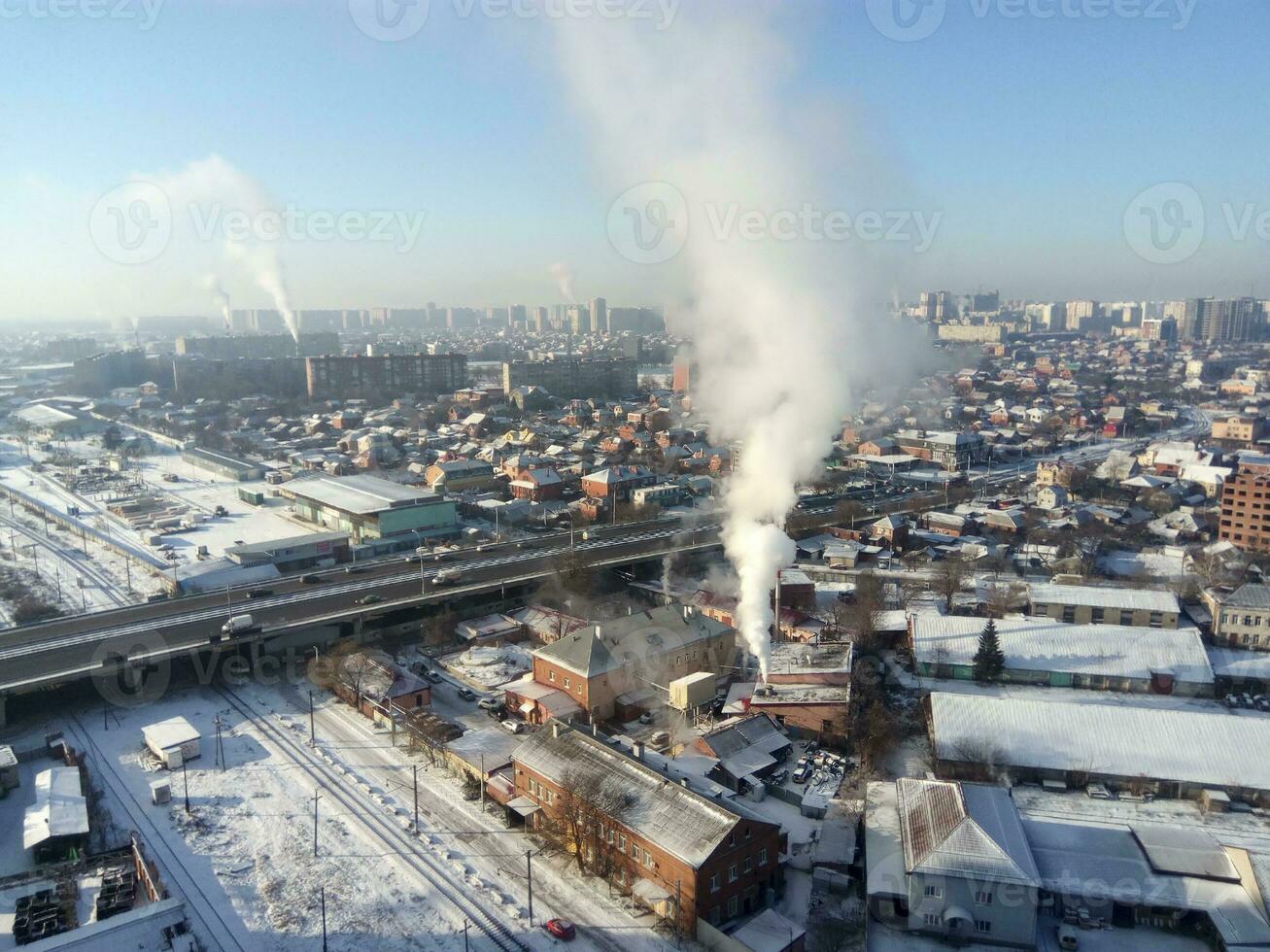 Winter town. Frosty sunny day in the city. Snow on the streets a photo