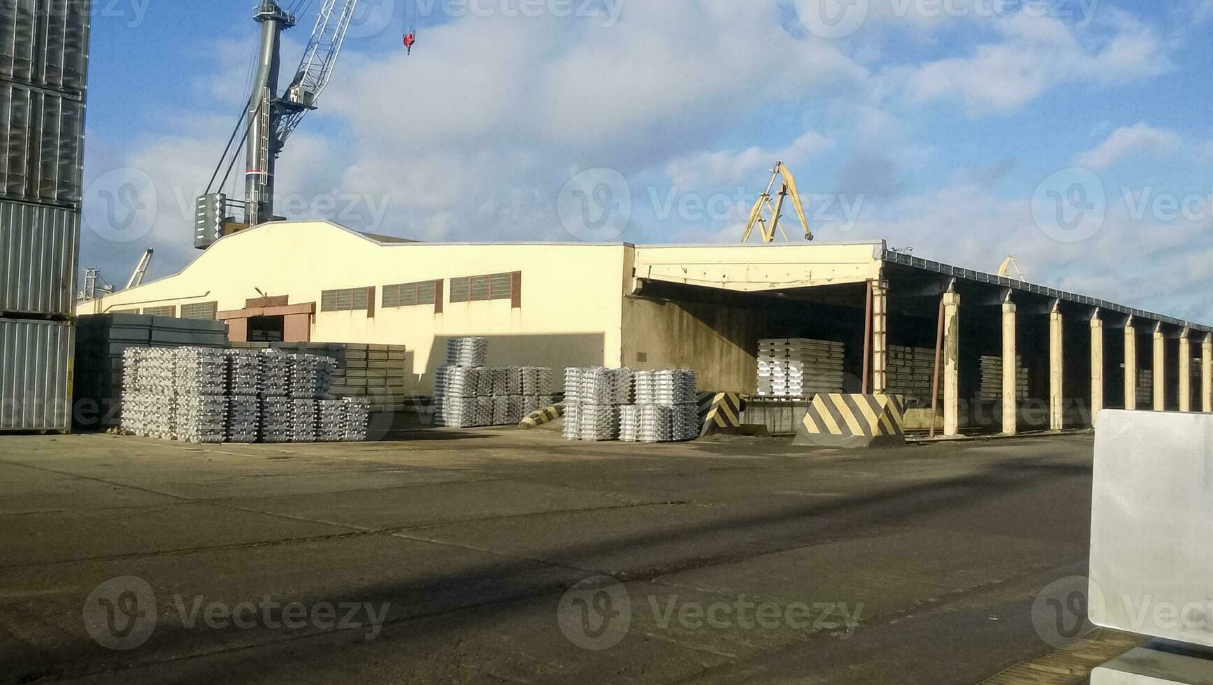 A port warehouse of aluminum ingots. Warehouse goods photo