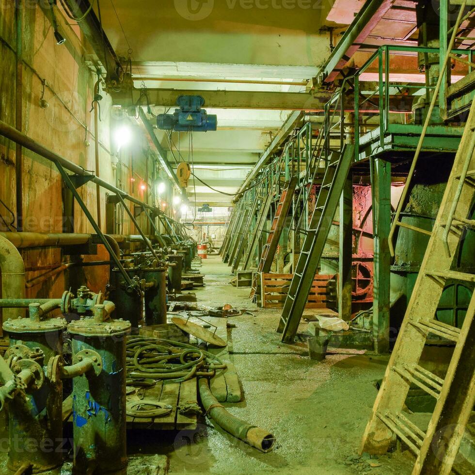 Basement of a water pumping station. Abandoned post-apocalyptic photo