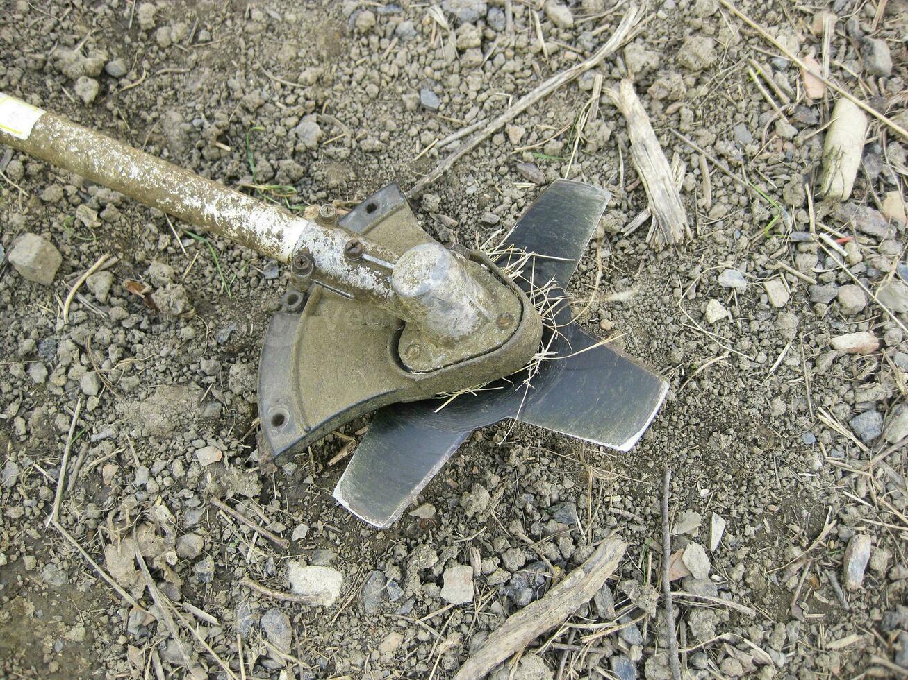 Knife on the trimmer for cutting grass and bushes photo