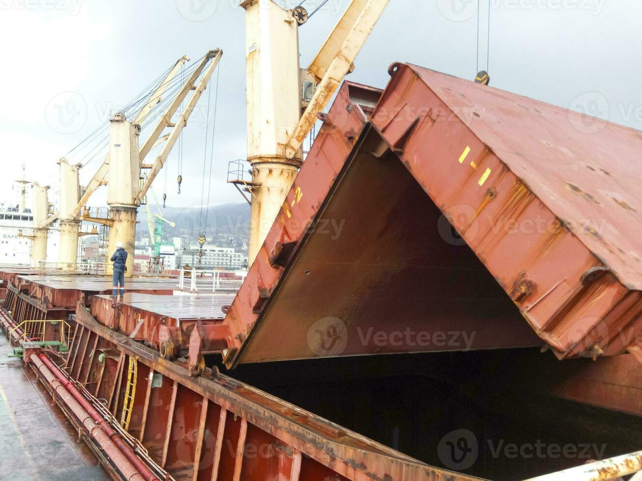 Folded steel roof of the hold on the ship. photo