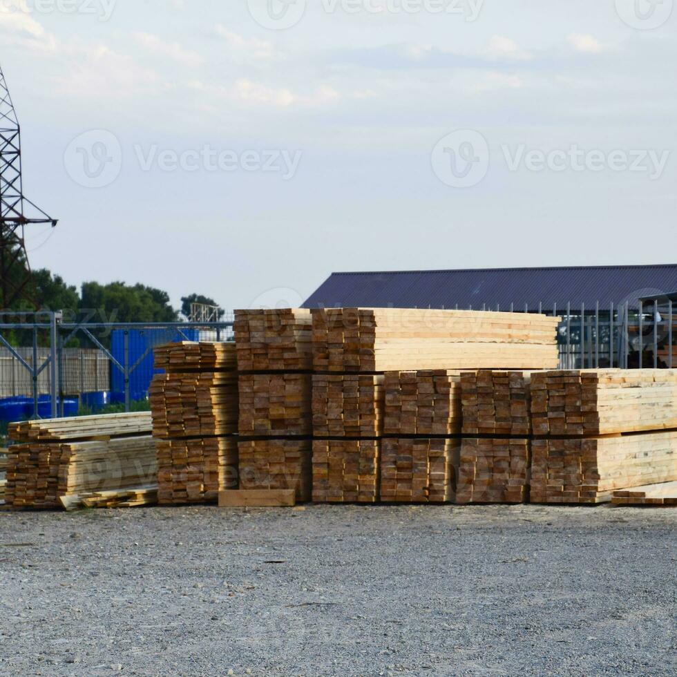 Folded new board at the construction base. Timber. Board of pine photo