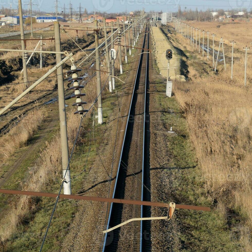 Plot railway. Top view on the rails. High-voltage power lines for electric trains photo